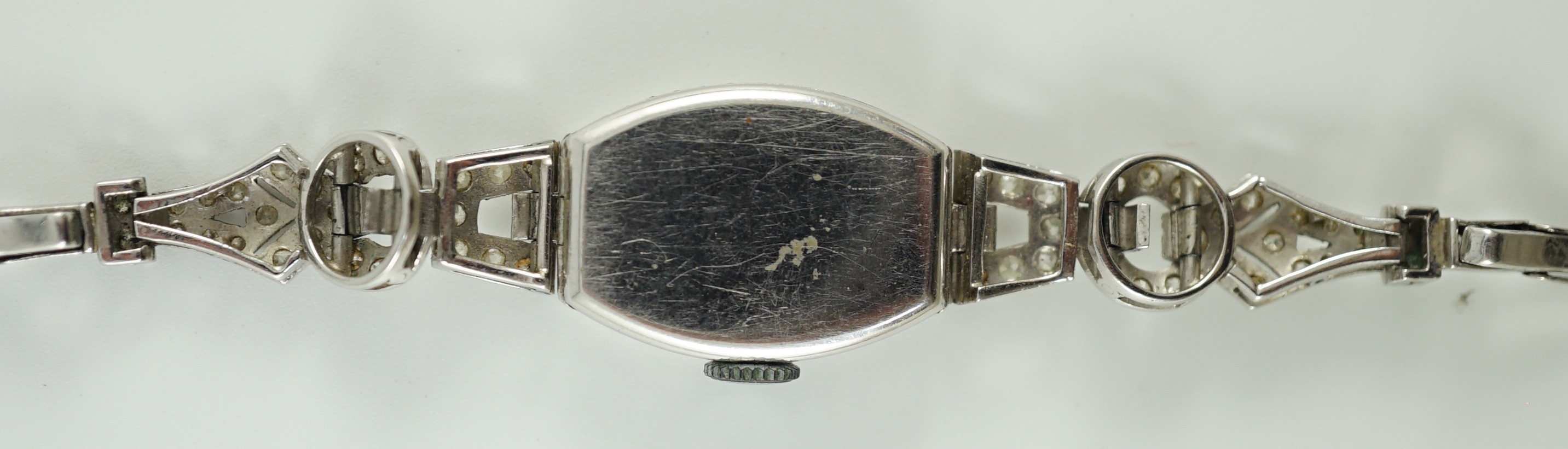 A lady's 1920’s platinum and round brilliant cut diamond set manual wind cocktail watch, on a white gold expanding bracelet